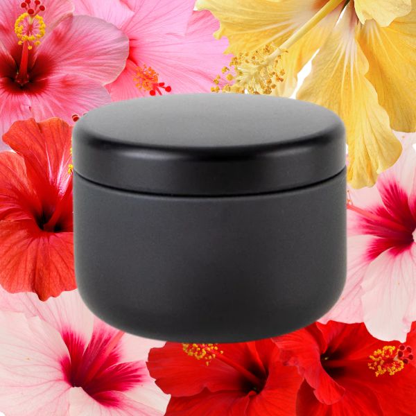 Candle against hibiscus background