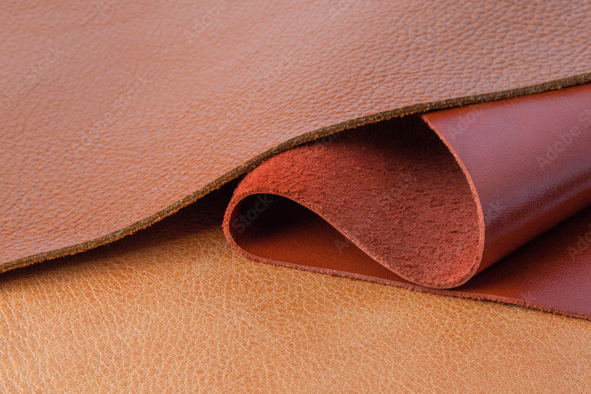Close-up of tan leather and suede texture — crushed leather scent note in Kinkette DIRTY BOY luxury candle