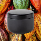 Candle against cocoa background