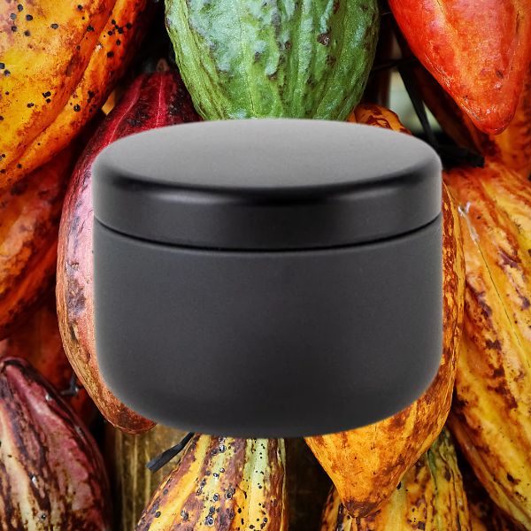 Candle against cocoa background