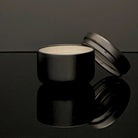 Discovery Candle Against Black Background