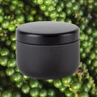 Candle against peppercorn background